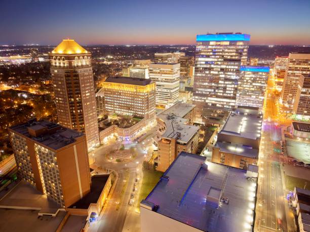Downtown skyscrapers with skyline and traffic at dusk